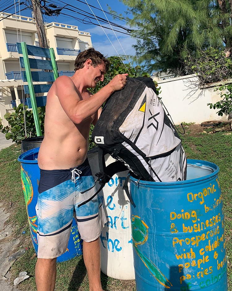 saving the planet, picking up plastic litter off the beach in Barbados